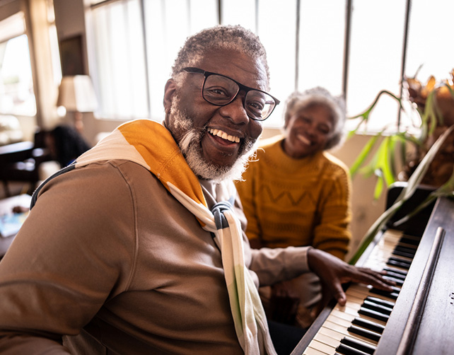 investments callout banner couple playing piano